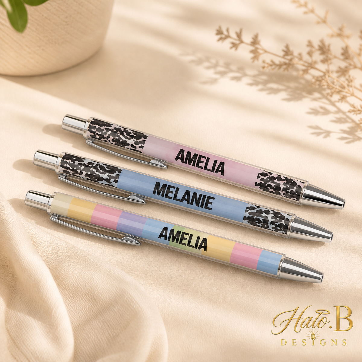 Personalized text-printed pens with new gold Halo B Designs watermark