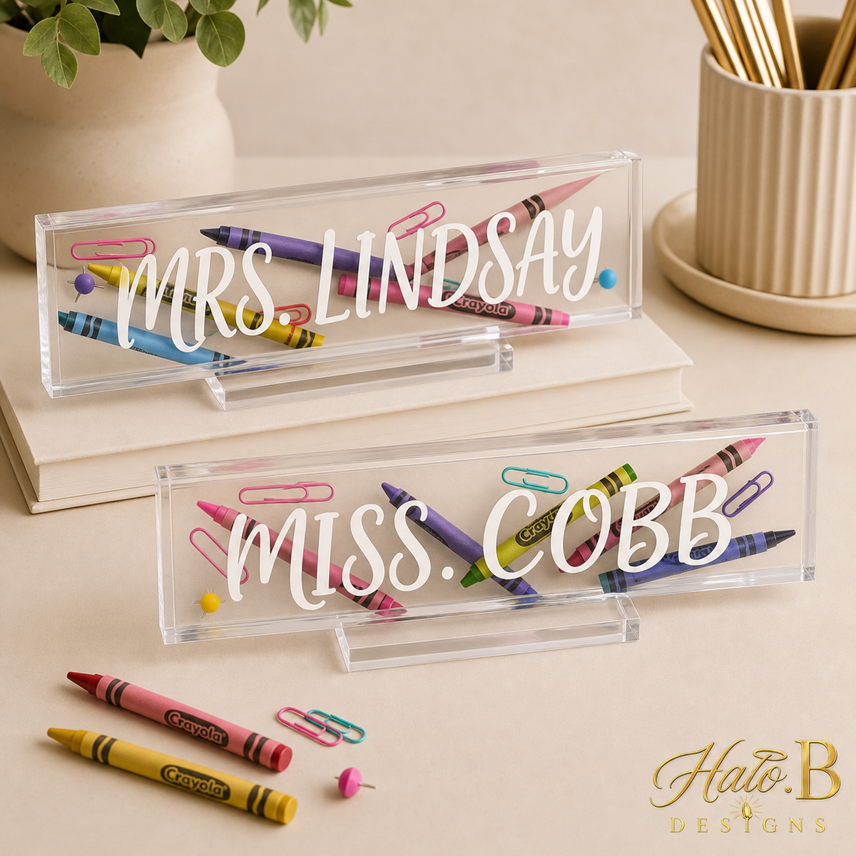 Two personalized clear acrylic desk name plates with new gold Halo B Designs watermark
