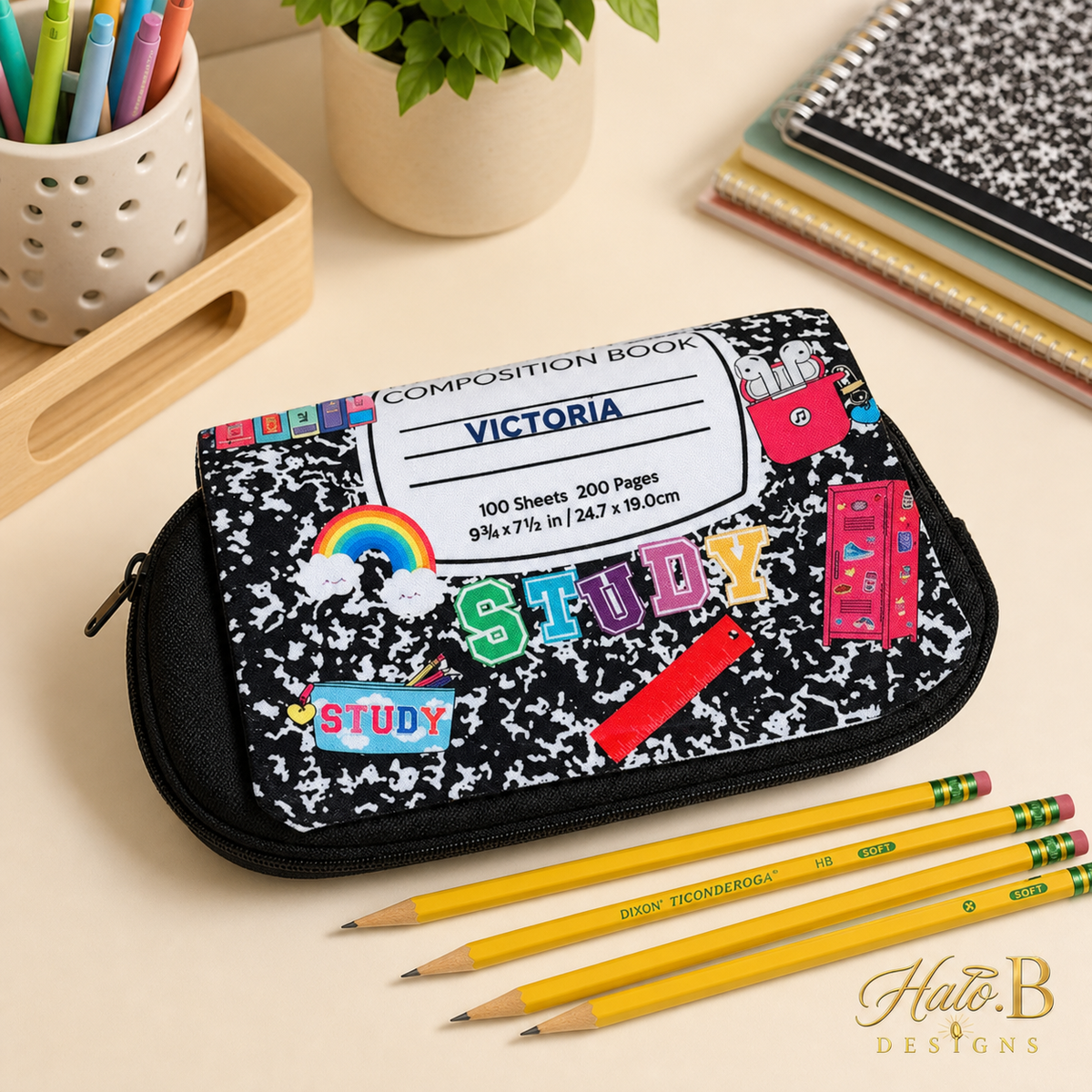 Personalized composition-style school pencil case with Victoria name and gold Halo B Designs watermark