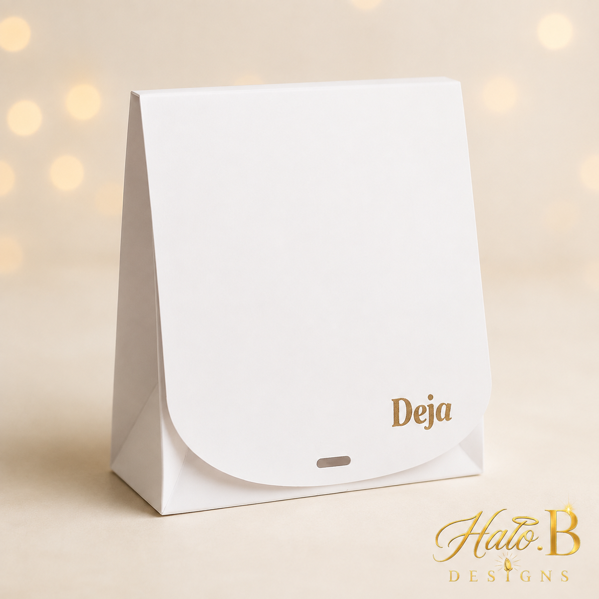 White flat gift box personalized with Deja in gold